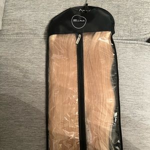 22 inch Bellami Boogatti clip in Hair Extensions in the color Dirty blonde.